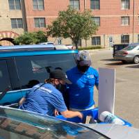 Sara Maas and Anirudh Chowdhary load a bin